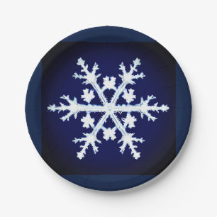 A Giant Ice Crystal Snowflake on Dark Indigo Blue Paper Plate