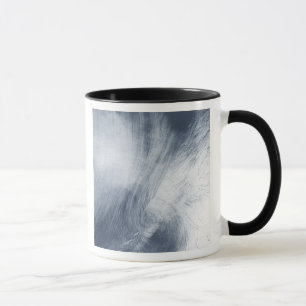A giant whirlpool cloud swirls above the sea mug