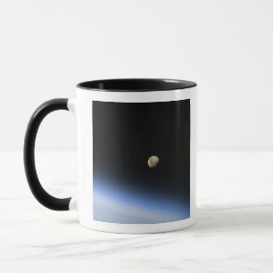 A gibbous moon visible above Earth's atmosphere 2 Mug