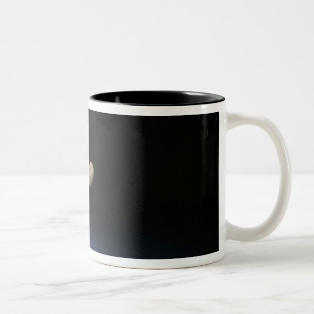 A gibbous moon visible above Earth's atmosphere 2 Two-Tone Coffee Mug (Right)