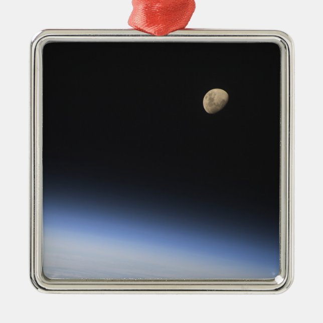 A gibbous moon visible above Earth's atmosphere Metal Tree Decoration (Front)