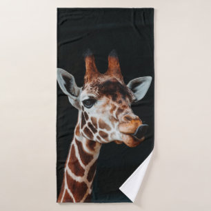 A GIRAFFE AT CALGARY ZOO POKING HIS TONGUE OUT BATH TOWEL