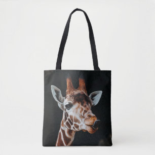 A GIRAFFE AT CALGARY ZOO POKING HIS TONGUE OUT TOTE BAG