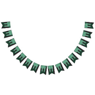 a green and black pattern with a tree in the middl bunting