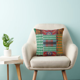 a green and black pattern with a tree in the middl cushion