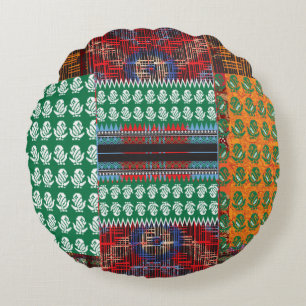 a green and black pattern with a tree in the middl round cushion