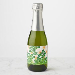 A green and gold artistic pattern depicting a tree sparkling wine label
