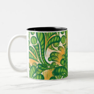 A green and gold artistic pattern depicting a tree Two-Tone coffee mug