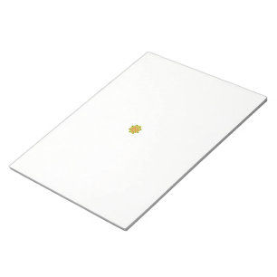 a green and red flower with black dots notepad