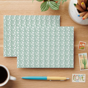 a green and white background with a pattern envelope