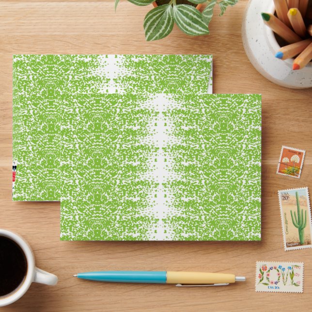 a green and white background with small dots envelope (Desk)