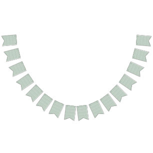 a green and white background with small leaves bunting