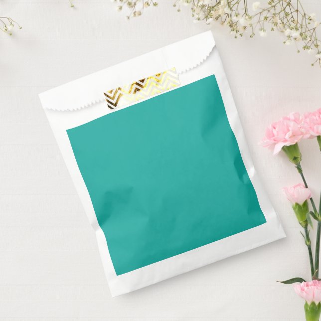 a green background with a  favour bags (Sealed)