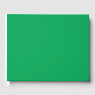 a green background with a guest book