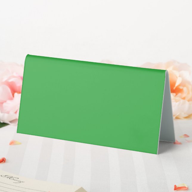 a green background with a white border (In SItu (Wedding))
