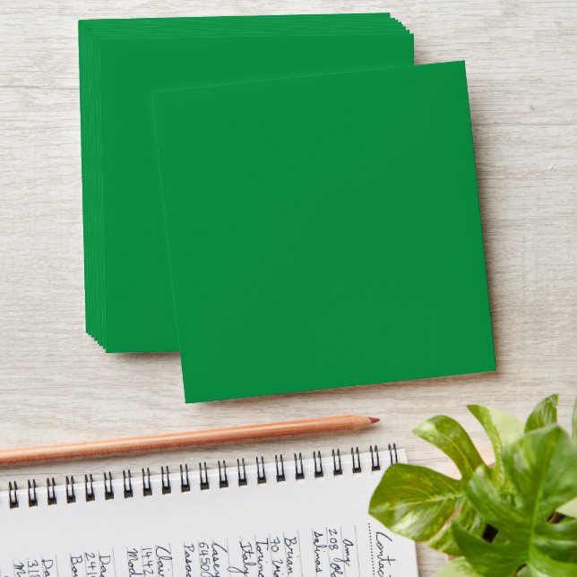 a green background with a white border envelope (Stacked)