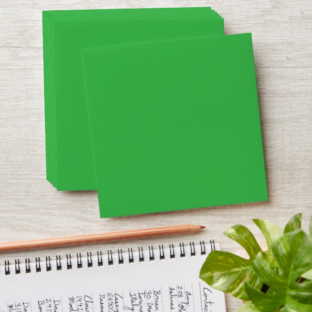a green background with a white border envelope (Stacked)