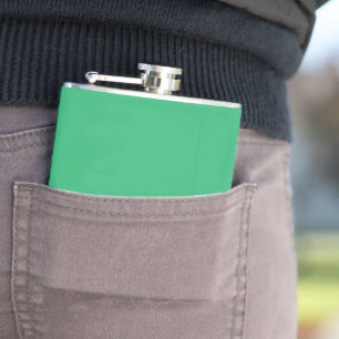 a green background with a white border hip flask