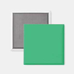 a green background with a white border magnet