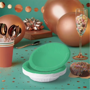a green background with a white border paper plate