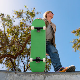 a green background with a white border skateboard