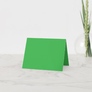 a green background with a white border thank you card