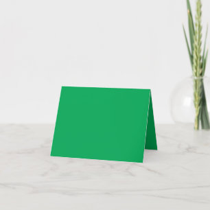 a green background with a white border thank you card
