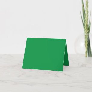 a green background with a white border thank you card
