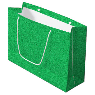 A green glittery shopping bag with white handles