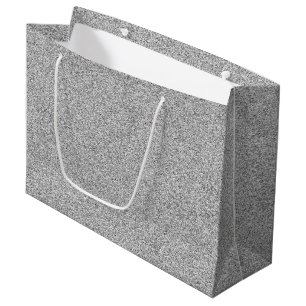 A grey gift bag with white handles