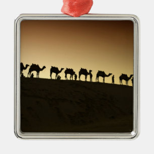 A group of camel herders with their camels metal tree decoration