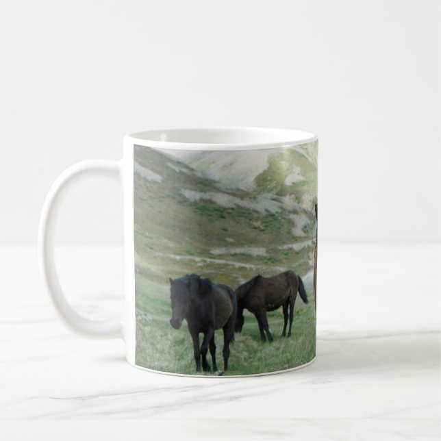 A GROUP OF HORSES ON A MOUNTAIN PASTURE COFFEE MUG (Left)