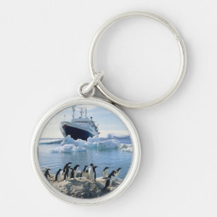 A Group Of Penguins Standing On An Icy Beach Key Ring