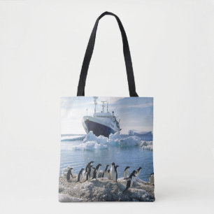 A Group Of Penguins Standing On An Icy Beach Tote Bag