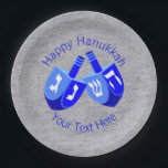 A Hanukkah Dreidels Blue Festival of Lights Party Paper Plate<br><div class="desc">Set on a faux silver-look backing, two Hanukkah Dreidels in white and vivid blues set the mood for your Chanukah celebration. These Hanukkah party paper plates have two lines of bright blue text to be customised and personalised, from changing the holiday greeting to adding your name or date. Truly one-of-a-kind,...</div>