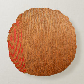 a hay cylindrical bale in a field on round pillow