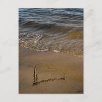 A heart on sand and in rainbow colours
