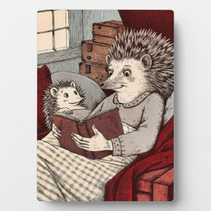 A Hedgehog in a cover reading a book at Plaque