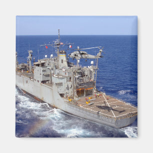 A helicopter clears the flight deck magnet