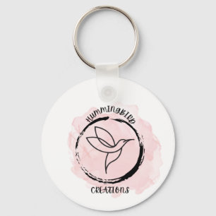 A hummingbird design for a logo on a keychain