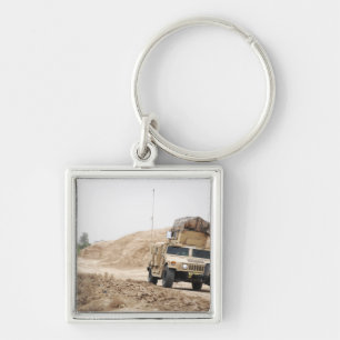 A Humvee conducts security Key Ring