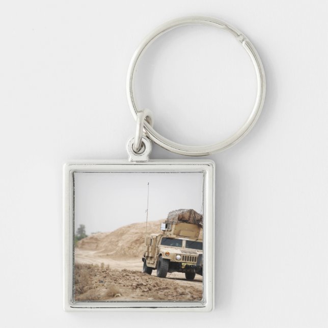 A Humvee conducts security Key Ring (Front)
