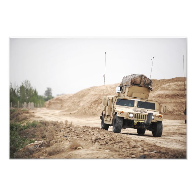 A Humvee conducts security Photo Print (Front)