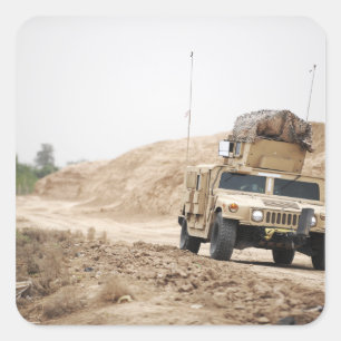 A Humvee conducts security Square Sticker