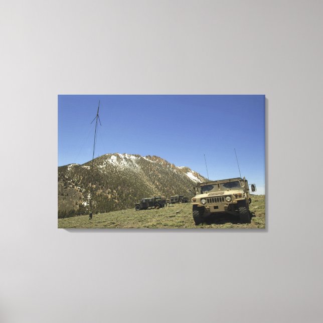 A Humvee is parked at the re-transmitting site Canvas Print (Front)