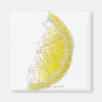 A juicy ripe organic lemon wedge fruit submerged