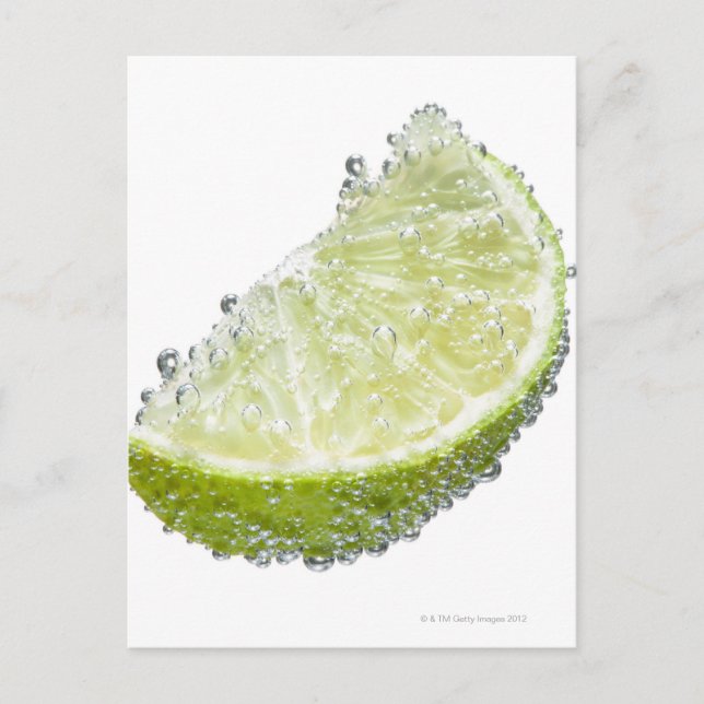 A juicy ripe organic lime wedge fruit submerged postcard (Front)