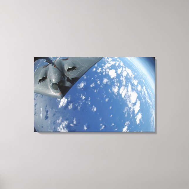 A KC-135 Stratotanker refuels a B-2 Spirit Canvas Print (Front)
