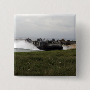 A landing craft air cushion comes ashore 15 cm square badge