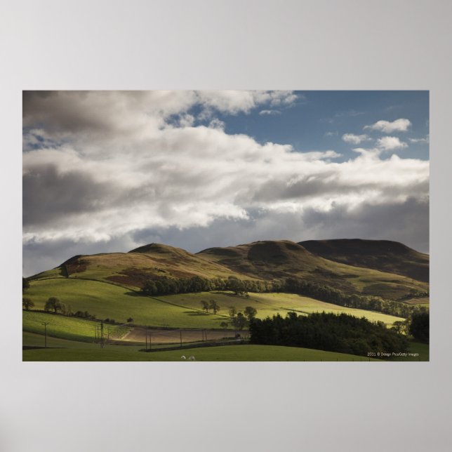 A Landscape With Rolling Hills And Clouds Overhead Poster (Front)